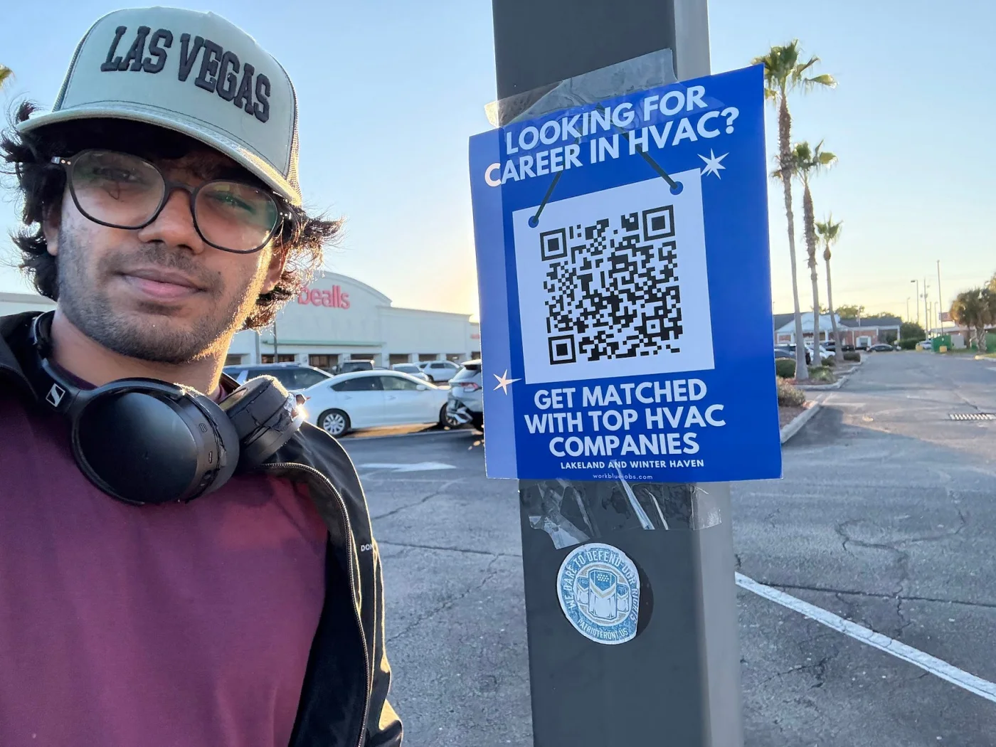 Nemath beside an HVAC recruiting flyer in Winter Haven